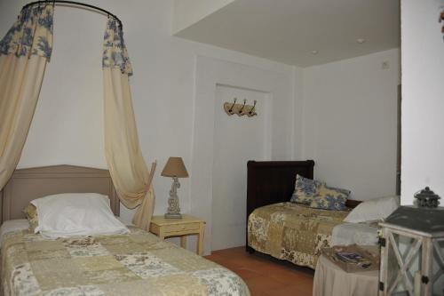 Posteľ alebo postele v izbe v ubytovaní Gte De Charme lOlivier