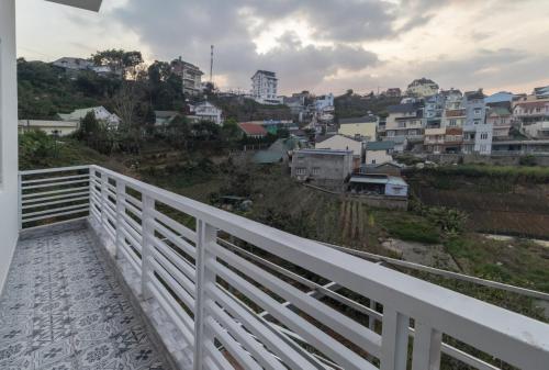 a white bridge with a view of a city at MrLee Dalat House in Da Lat