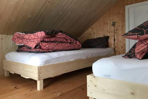 Posteľ alebo postele v izbe v ubytovaní Nordlandshus ved Lofotr