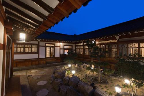 a building with a courtyard with candles and lights at Hanok1957 in Daegu
