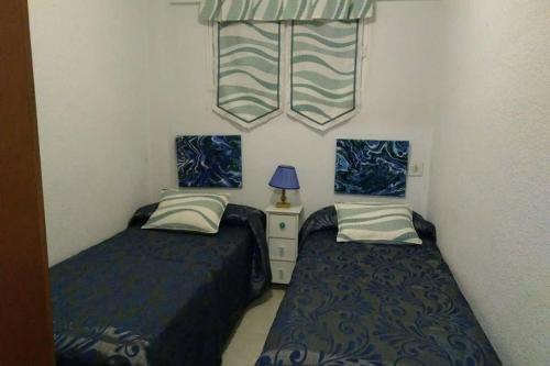 Postel nebo postele na pokoji v ubytování Moby Dick 6B (Verblijf aan de Costa)