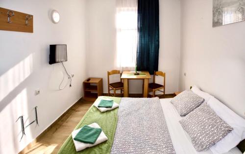 A bed or beds in a room at Apartments Ozren