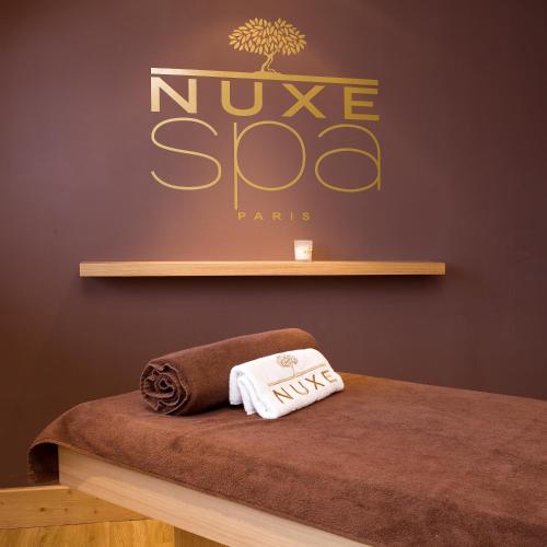 a sign for a nuke spa on a wall at Hotel La Chaudanne in Méribel