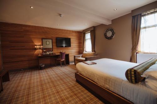 Postel nebo postele na pokoji v ubytování Lynnhurst Hotel
