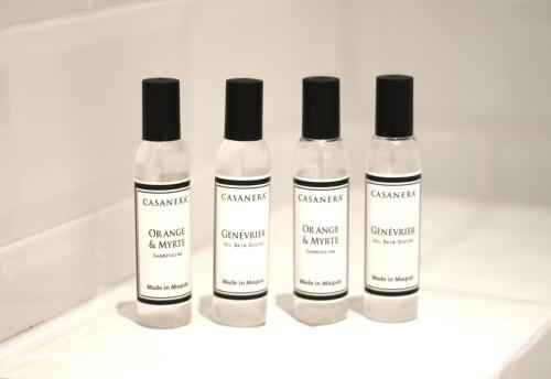 three bottles of cambril and amnesia sitting on a counter at 1er Etage Marais in Paris