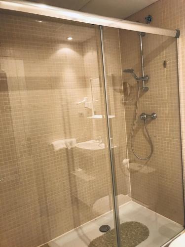 a bathroom with a shower and a sink at The Hotel 592 - Adults Only in Barcelona