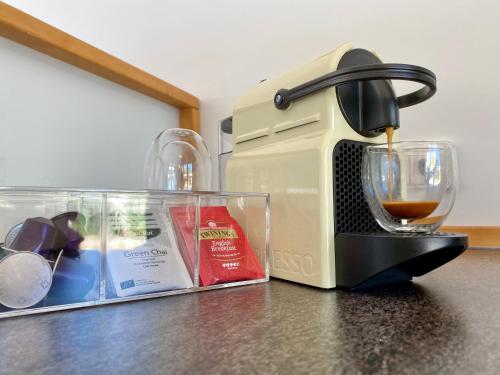 a coffee maker sitting on top of a counter at Jávea Apartment Mar in Jávea