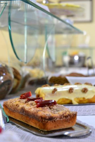 a plate with a piece of food on a table at Curi Palace Hotel in Pelotas
