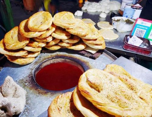 a bunch of bread on a table with sauce at 7Days Inn Yingshang LAN-STAR building materials market in Fuyang