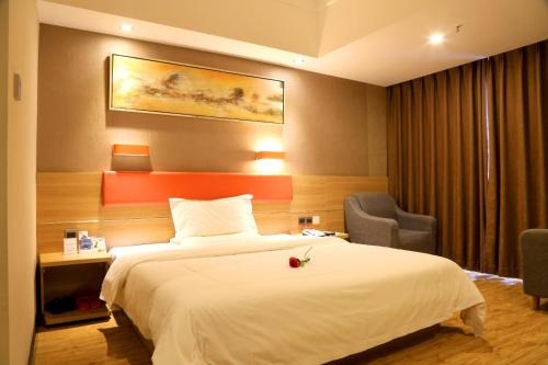 Postelja oz. postelje v sobi nastanitve 7Days Premium Neijiang Wanda Square