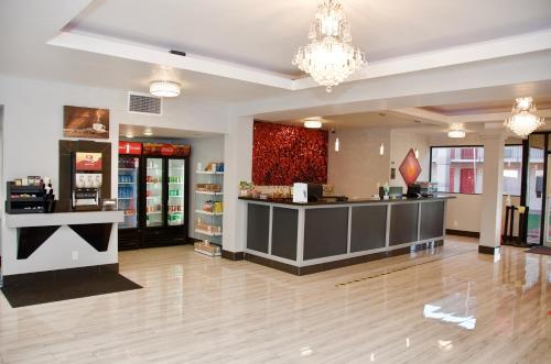 a store lobby with a cash register and a counter at Ramada by Wyndham Yuma in Yuma