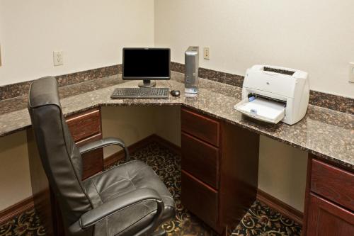 a office with a desk with a computer and a printer at Country Inn & Suites by Radisson, Elkhart North, IN in Elkhart