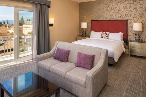 a hotel room with a bed and a couch at Hotel Shattuck Plaza in Berkeley