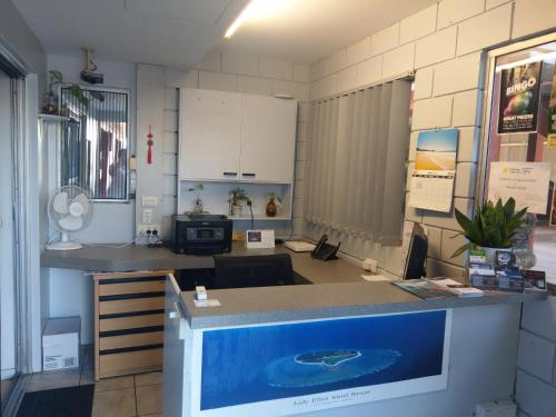 a kitchen with a large island in a room at Matilda Motel in Bundaberg