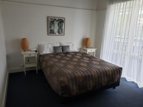 Ένα ή περισσότερα κρεβάτια σε δωμάτιο στο Marlo Hotel