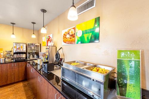 a fast food restaurant with a counter with food at Quality Inn Three Rivers in Three Rivers
