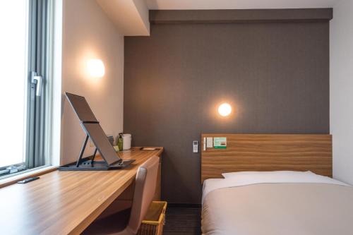 Cama o camas de una habitación en Super Hotel JR Ueno Iriyaguchi