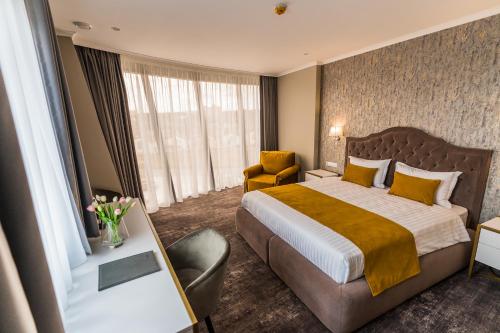 Postel nebo postele na pokoji v ubytování Hotel Aventus