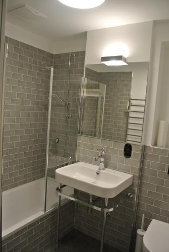 Ένα μπάνιο στο Haus Wiesberger Apartment TOP25 Südseite