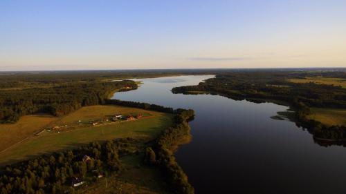 an aerial view of a river with trees and water at Apartamenty Oleńka I - Szczytno Mazury in Szczytno