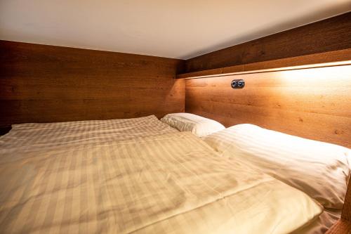 Ένα ή περισσότερα κρεβάτια σε δωμάτιο στο Haus Wiesberger Apartment TOP25 Südseite