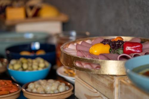 a table with bowls of food on a table at V Boutique Hotel in Jeddah
