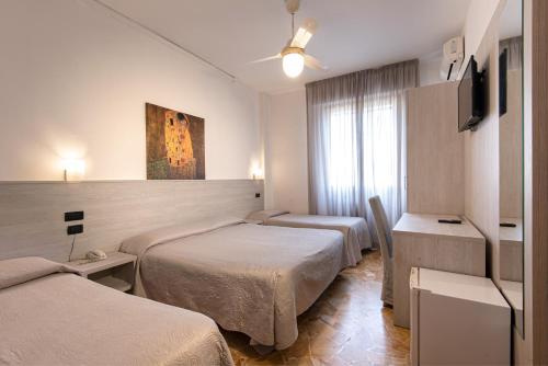 Giường trong phòng chung tại Hotel Careggi