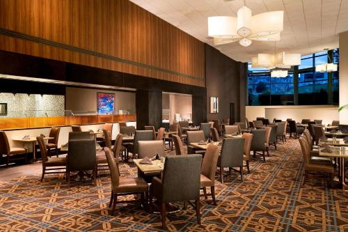 a dining room filled with tables and chairs at The Stamford Hotel in Stamford