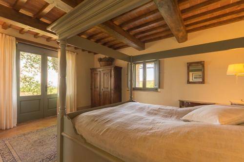 Tempat tidur dalam kamar di Casale Santa Barbara