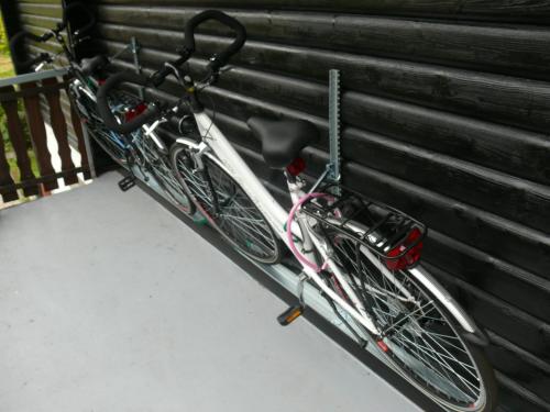 a bike is parked next to a wall at FeWo Falk 26 OG am See in Arrach