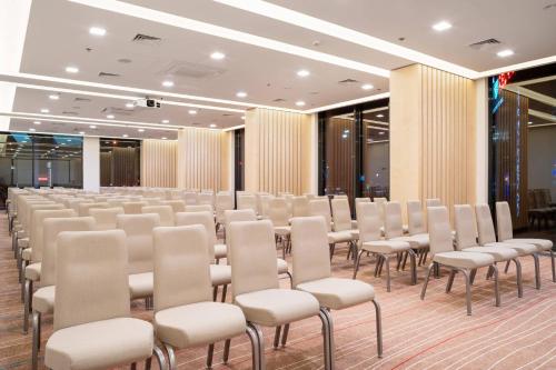 a room with rows of chairs in a building at Sky Loft Hotel Kyiv by Rixwell International in Kyiv