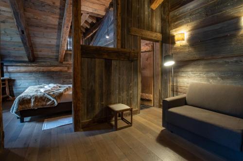 Katil atau katil-katil dalam bilik di Chalet Svizzero Apartments