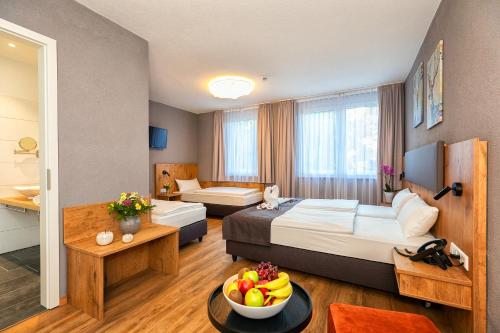 Postel nebo postele na pokoji v ubytování Hotel La Mirabelle close to Europa Park