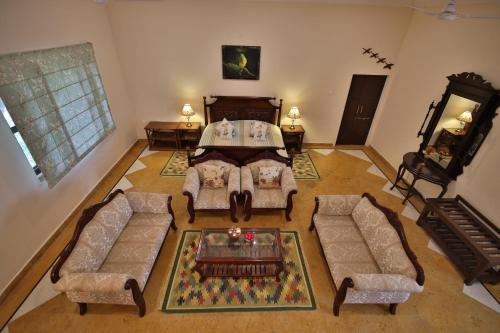 an overhead view of a living room with a couch and chairs at Roop Niwas Kothi, Near Mandawa in Nawalgarh