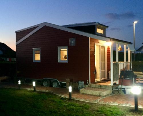a small house with lights in front of it at Tinyhouse Bamberg in Pettstadt