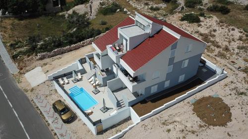 an aerial view of a house with a swimming pool at Belvedere Premium in Novalja