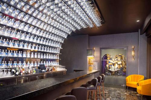 a bar with a lot of bottles on the wall at Hyatt Regency Grand Reserve Puerto Rico in Rio Grande