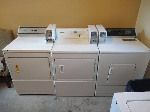 three washing machines sitting on top of each other at Townhouse Motel in Lusk