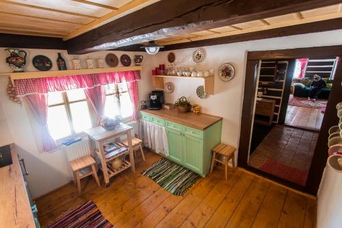 an overhead view of a kitchen with a table and chairs at Chalupa Šárka in Dolni Dvur