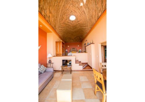 a living room with a couch and a table at Casa Estrella de la Valenciana Hotel Boutique in Guanajuato