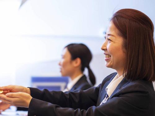 two women sitting at a table in a room at Hotel Sapporo Garden Palace in Sapporo