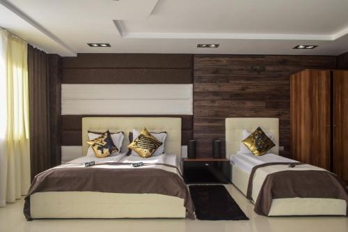 Postel nebo postele na pokoji v ubytování Hotel Acktion