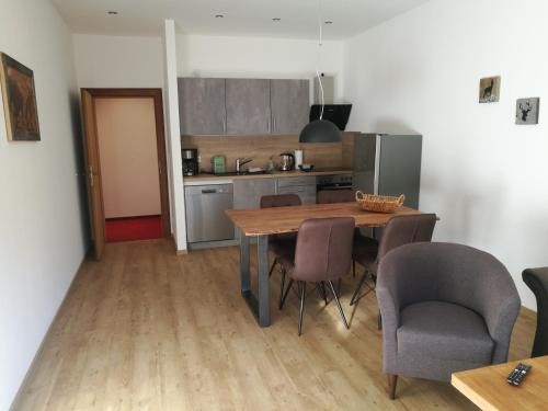 a kitchen with a table and chairs in a room at Ferienhaus Wetterstein in Grainau
