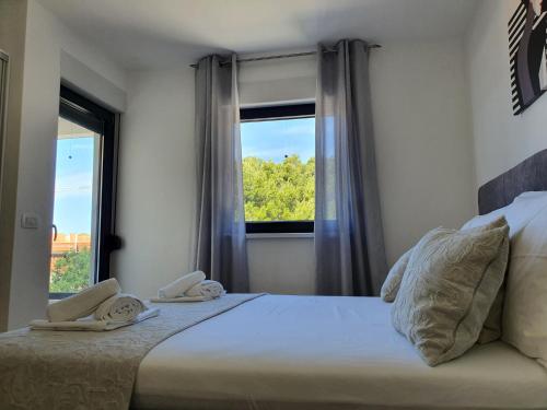 Ένα ή περισσότερα κρεβάτια σε δωμάτιο στο Villa La Vita