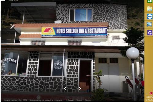 a building with a sign that reads music station into a restaurant at Hotel Shelton Inn in Batkarar