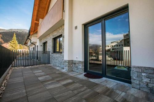 a balcony with a view of a building at Vila Mojca Apartma Eva-Neža, Kranjska Gora (center) in Kranjska Gora