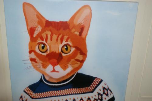 a painting of a cat wearing a sweater at 10to12 Folkestone in Folkestone