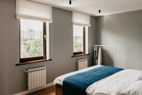 En eller flere senge i et værelse på Terrace apartment near beach