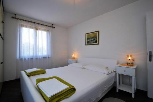 Postel nebo postele na pokoji v ubytování Apartman Dinka