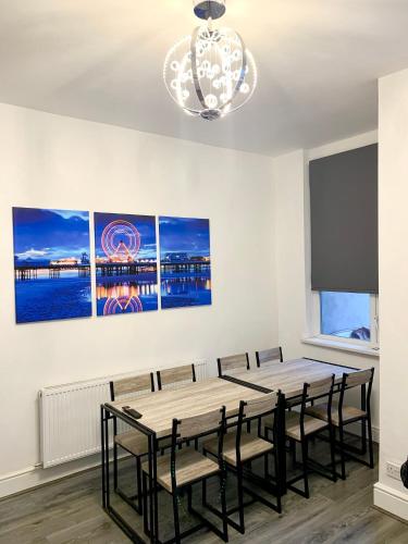 a dining room with a table and chairs at Victory hot tub house in Blackpool